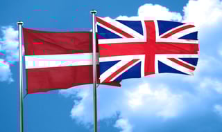 Latvia and UK flags waving together