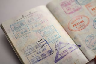 Open passport with multiple entry stamps