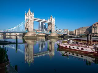 Tower Bridge Reflected In The River Thames
