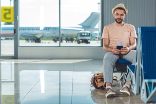 Traveler holding passport and boarding pass