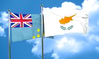 UK and Cyprus flags waving together