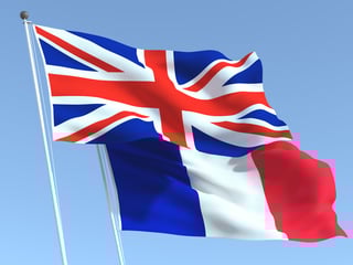 UK and France flags waving together