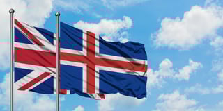 UK and Iceland flags waving together