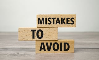 Wooden blocks showing mistakes to avoid