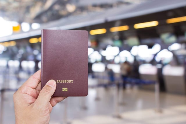 Man Hand Holding Passport