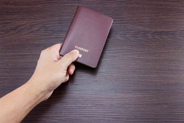 Passport On Brown Dark Wooden Table