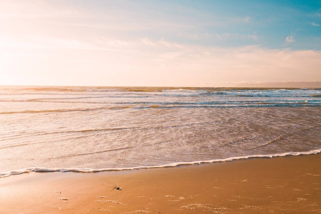 Sunny Sandy Beach With Gentle Waves