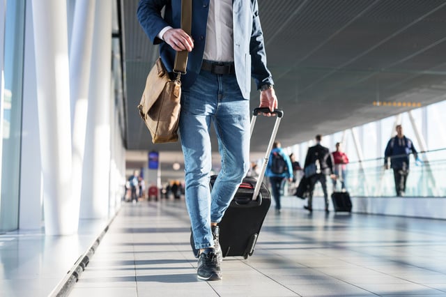 Tourist Walking Inside An Airport