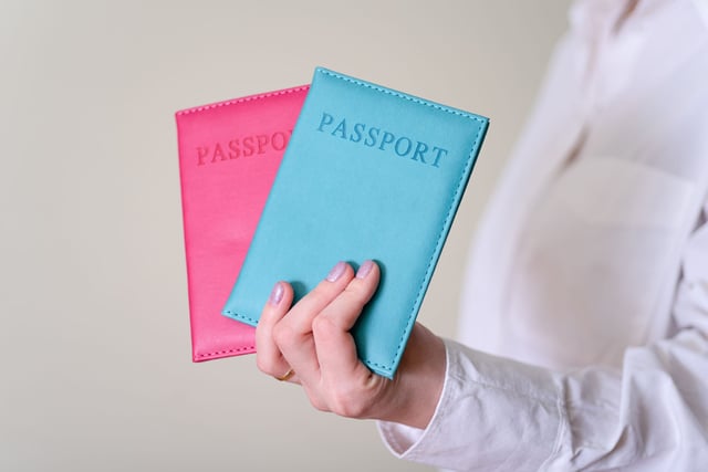 Woman Holding Two Passports