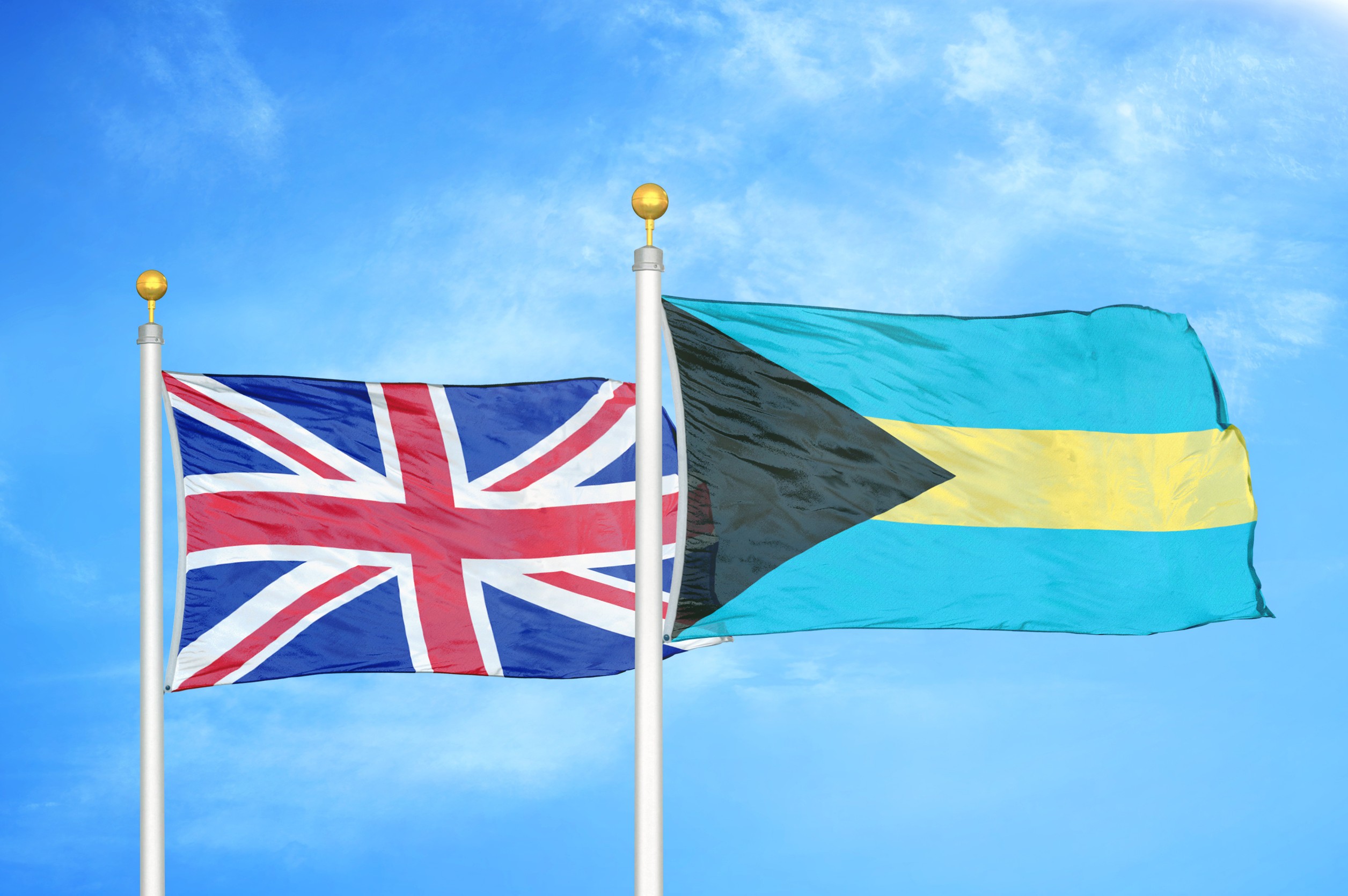UK and Bahamas flags flying