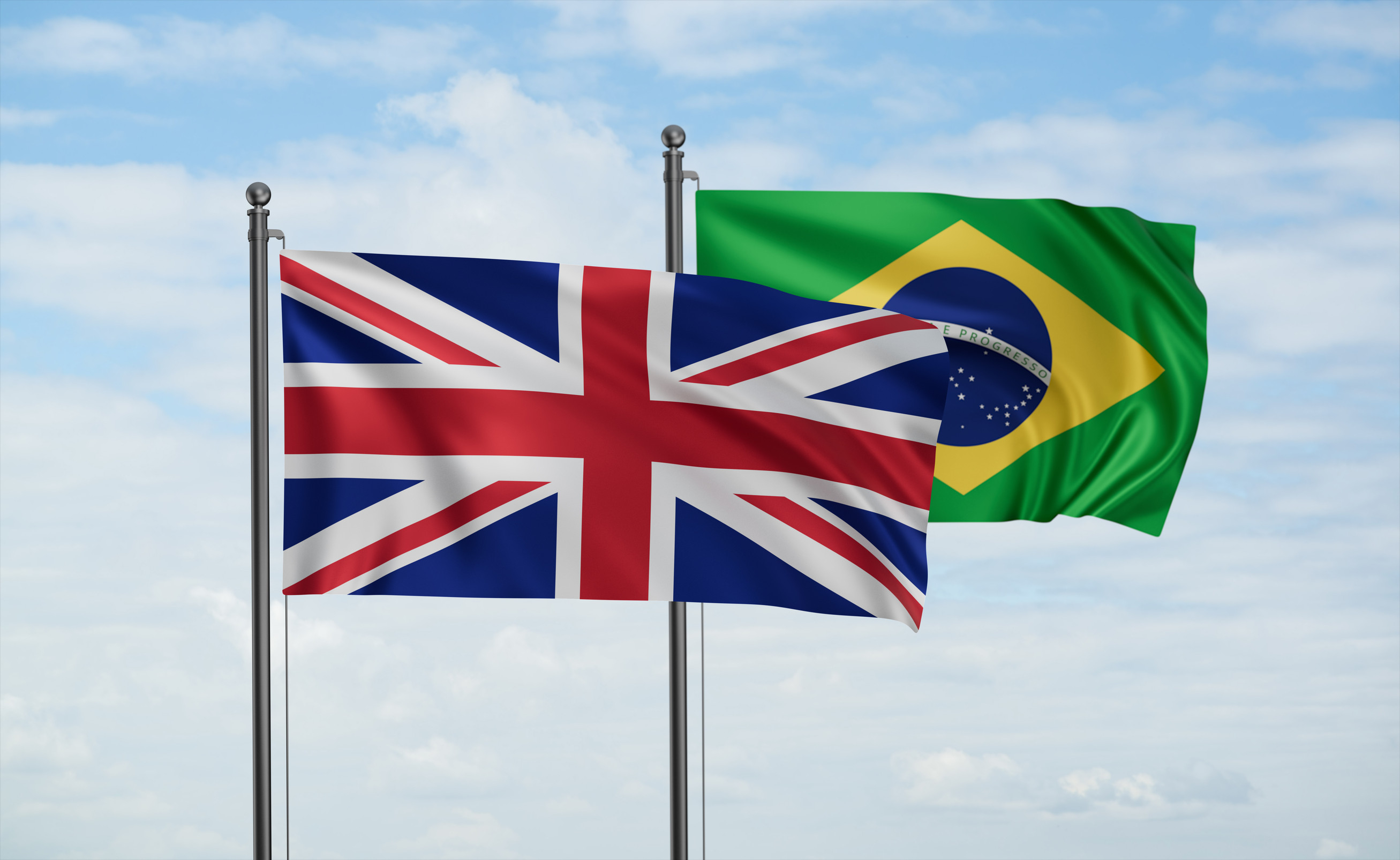 UK and Brazil flags waving