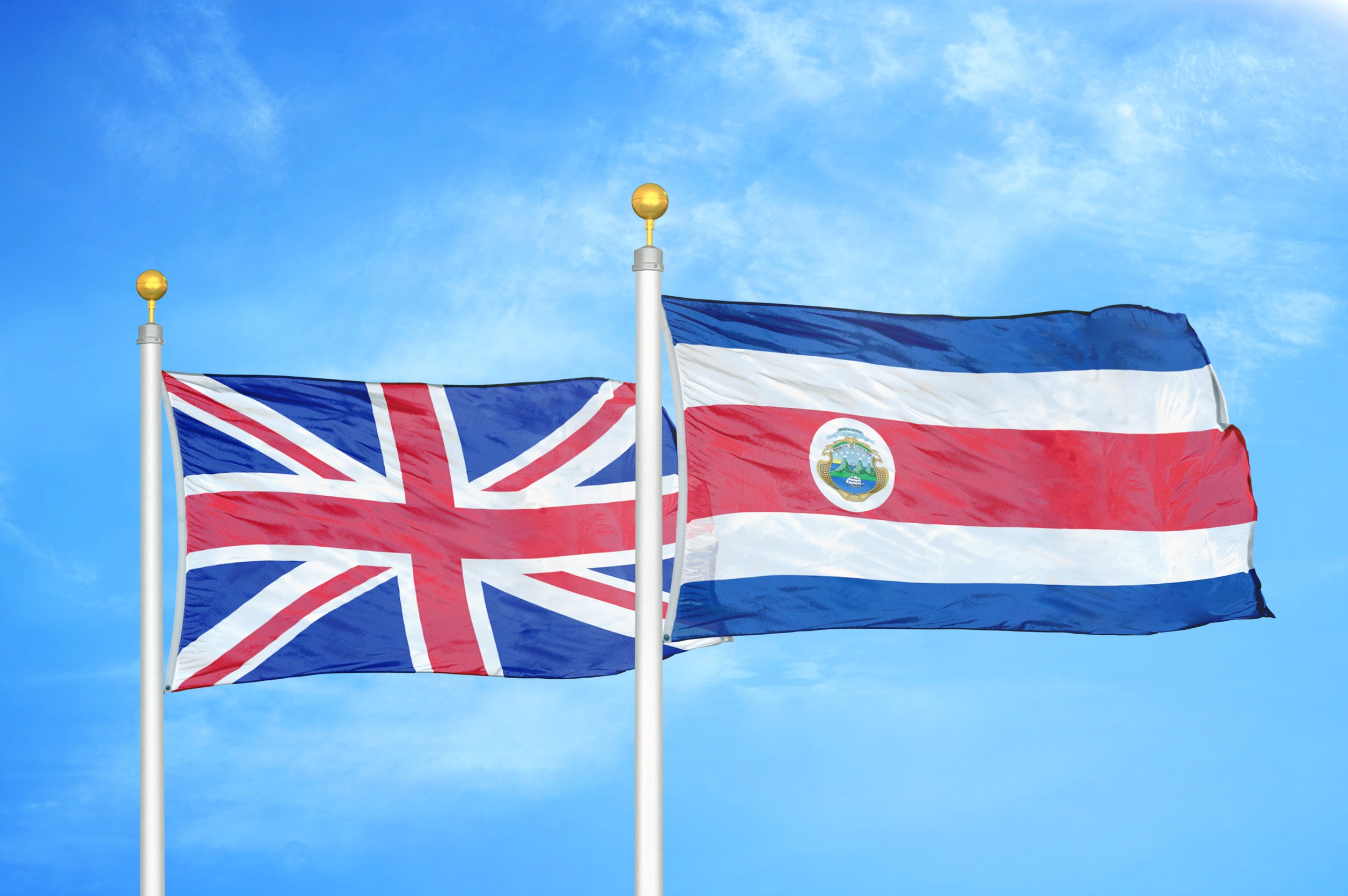 UK and Costa Rica flags waving